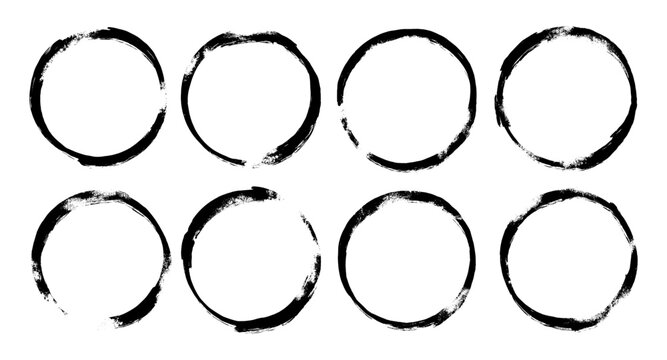 A collection of eight black spray paint circle frames featuring a raw grunge texture and authentic urban graffiti style, perfect for distressed borders and creative graphic design elements