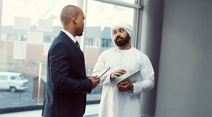 Fototapeta premium Meeting, communication and business people on tablet for finance review, proposal and investment research. Office, teamwork and Muslim man with tech for budget, growth and feedback report or plan
