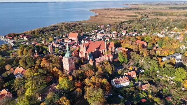 Castle complex in Frombork, Poland aerial drone view of cathedral hill and historic towers in golden autumn light