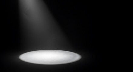 Dramatic spotlight illumination on dark background for creative design