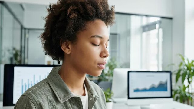 Calm gen z leader woman meditate in modern office peaceful thoughtful workplace focus