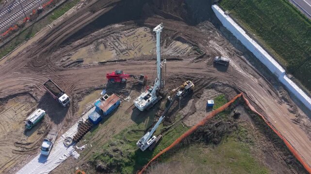 Aerial view of piling rig drilling foundations at a construction site