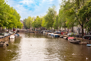 Canal with boats in Amsterdam city, Netherlands