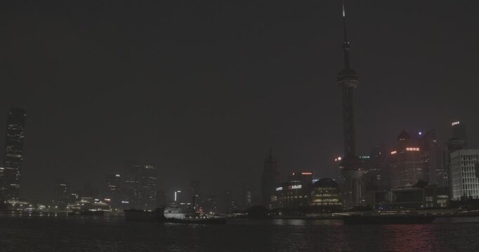 Spectacular Shanghai Harbor Views: Illuminated Cityscape and Water Reflections