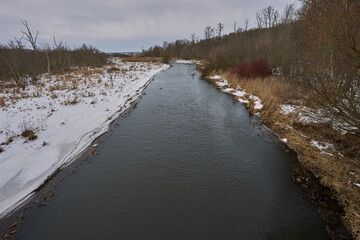Winding River Through Snowy Winter