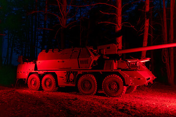 self-propelled artillery mount Suzanne in the forest. Military vehicle at night