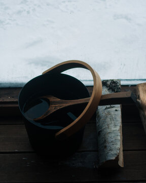 sauna bucket filled with water to put on the coal sauna
