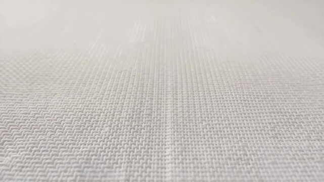 Delicate white woven texture background subtle motion high angle close up abstract fabric and textile design video