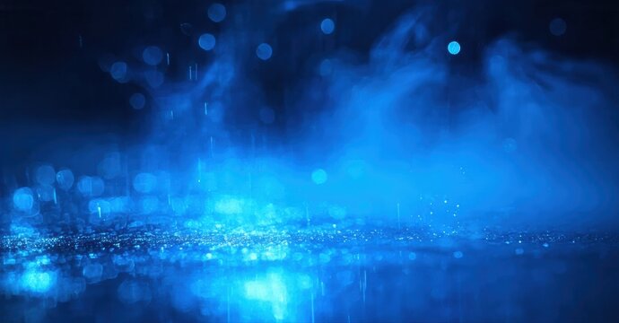 Wet asphalt reflects vibrant blue lights. Fog creates mysterious atmosphere, bokeh adds soft glow. Cityscape impression.