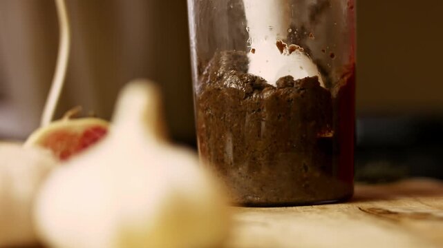 Using a blender to mash evenly the ingredients for Antarctica mushroom pate