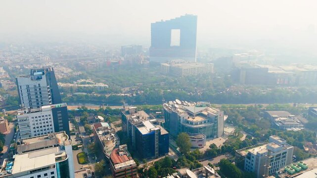 Modern Architecture in Sector 18 Noida India: Aerial View of the Building and City Skyline at Haze. Top down Buildings and Apartment with Multiple Building aerial.