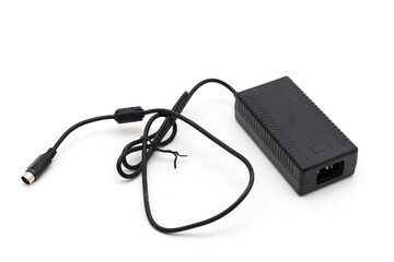 Black power adapter with cable on a white background