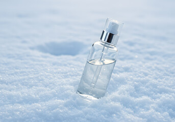 Glass bottle on snow