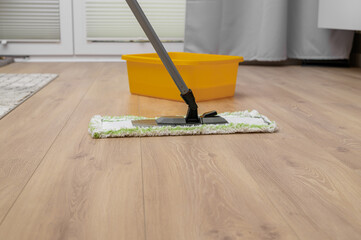 Washing floor panels at home, mopping the floor