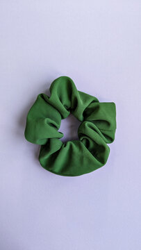 Scrunchie for hair isolated on violet background