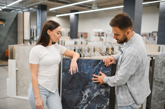 Couple shopping for tiles, choosing new flooring for home renovation