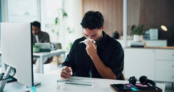 Man, computer and blowing nose in office with toilet paper, flu and sinus infection at marketing agency. Coworking, person and allergy in advertising company with tissue, virus symptoms and desktop.