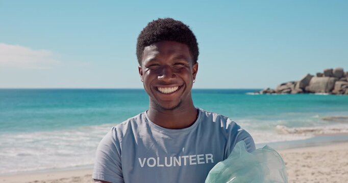 Volunteer, face and man with trash, beach and smile for social responsibility, cleaning or recycling. Happy, black person and waste removal for wildlife protection, pollution and community service
