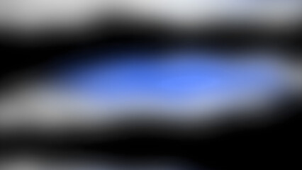 A blurry image with a blue and black background