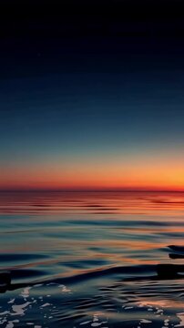 Glowing ocean waves roll under a vivid sunset sky, creating a dramatic and warm seascape with reflections of orange, red, and gold tones across the water. Slow motion aerial view