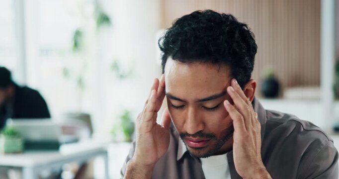 Tired, man and headache in office with stress, marketing challenge and fatigue from creative burnout. Coworking, exhausted person and migraine in advertising agency with mistake, problem and crisis.