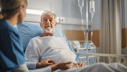 Obraz premium Elderly man resting in hospital bed with nurse beside him providing care and comfort in a clinical setting
