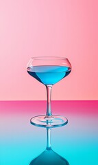 Elegant cocktail glass with vibrant blue drink on colorful background