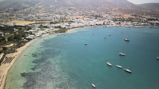 Aerial images of Paralia parikia beach on the island of Paros, Greece, during a sunny summer day, 1-inch sensor 4k 30fps