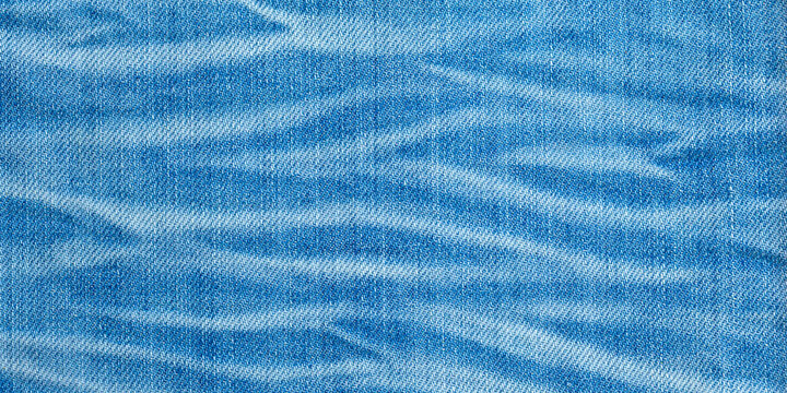 Blue denim fabric texture with worn pattern