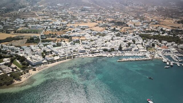 Aerial images of Paralia parikia beach on the island of Paros, Greece, during a sunny summer day, 1-inch sensor 4k 30fps