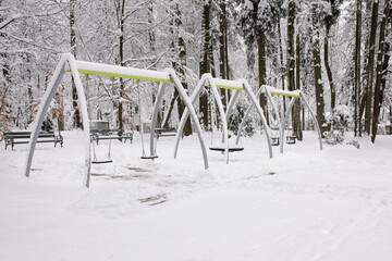 Winter Playground Equipment Covered in Snow