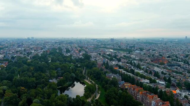 Amsterdam, Netherlands. Vondelpark. Museumplein square. Panoramic view of the city in summer in cloudy weather. Drone footage