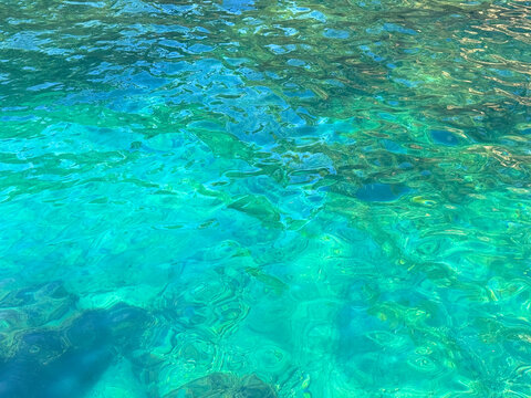 Azure blue water ocean surface background.