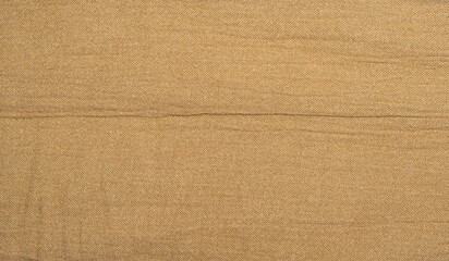 Fototapeta premium Elegant Brown Fabric Surface with Gentle Creases - Linen Wrinkle Texture Background