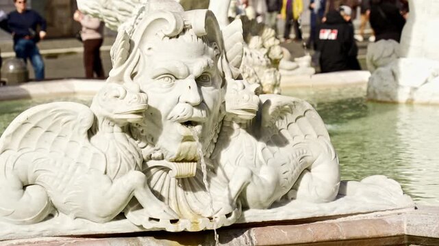 Baroque marble grotesque figure of a Triton spitting water in the Fontana del Moro, a famous fountain located at the southern end of the Piazza Navona in Rome, a UNESCO World Heritage site
