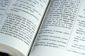 Fototapeta premium Arabic dictionary on a desk
