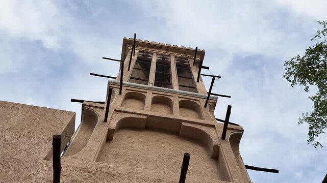 Low angle shot of traditional barjeel windtower with vents in Old Dubai, UAE