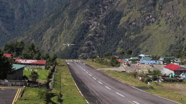 Airplane landing at Lukla Airport known as dangerous airport in Lukla, Nepal