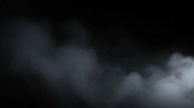Drifting Smoke or Fog Effect Against Black Backdrop Slow Motion