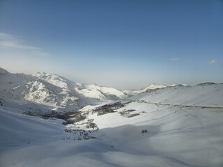 Deep snowy mountain valley with steep rugged slopes and pristine white snow covering the frozen gorge under a clear bright blue winter sky. Breathtaking high-altitude serenity. 
📍Hazarani, Hawraman 