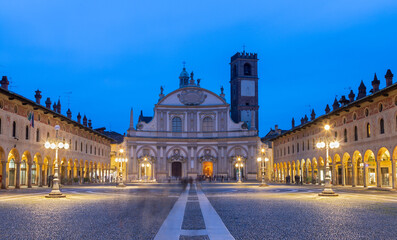 Fototapeta premium Vigevano - The Cathedral of St. Ambrose and PIazza Ducale square at dusk.