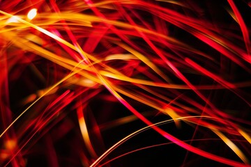 Vintage red and yellow light streaks on black background, dark academia abstract aesthetic