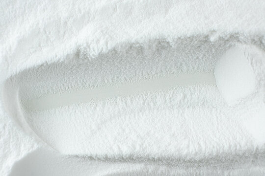 Soda powder sodium bicarbonate surface. Abstract white background with space for text