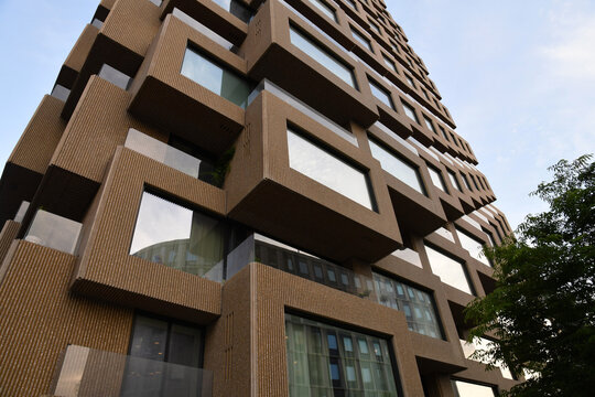 Low angle view of Norra Tornen contemporary residential towers with textured geometric architecture in Stockholm, Sweden