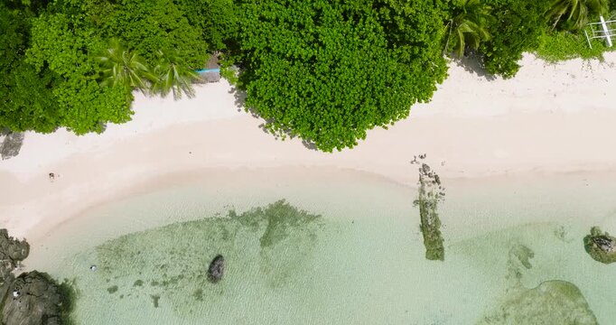 Tiamban Beach with waves and clear water on sandy beach. Romblon Island. Romblon. Philippines.