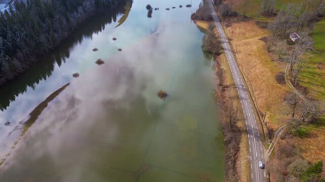 Scenic Aerial Panorama of Doubs Valley and Meandering River in France
High-altitude drone panorama capturing the Doubs Valley in eastern France, featuring a winding river cutting through forested moun