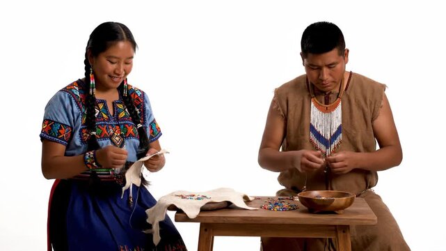 Native American Couple Crafting Traditional Clothing.