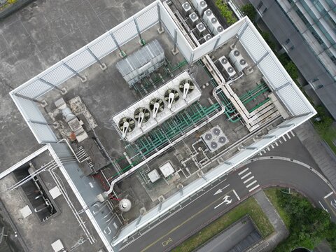  Aerial top-down view of complex cooling towers and piping for an AI data center