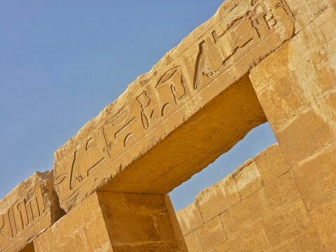 Hieroglyphic stone reliefs at the entrance of the dual Mastaba of Akhethotep and Ptahhotep II in Saqqara, Egypt