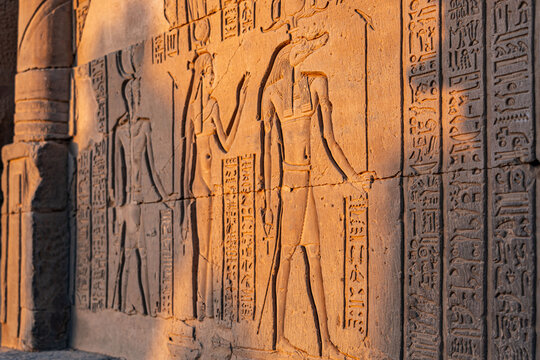 Golden Hour Relief of Crocodile God Sobek with Hieroglyphics at the Temple of Kom Ombo in Egypt